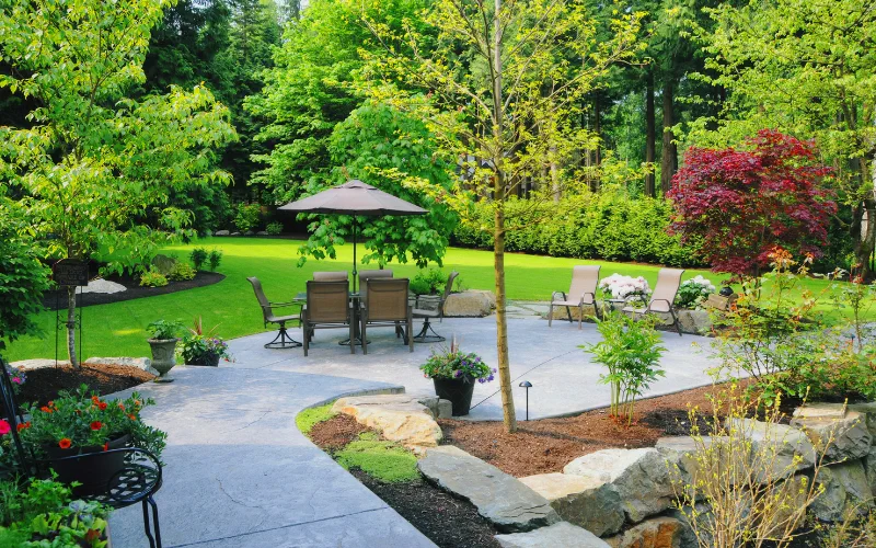 Patio area in Idaho Falls, Idaho, after professional tree trimming, showcasing a clean and well-maintained outdoor space.